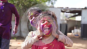 Celebration of Holi festival day colorful footage of Group of Cheerful kids playing holi