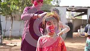 Celebration of Holi festival day colorful footage of Group of Cheerful kids playing holi