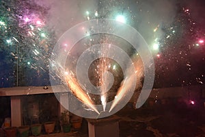Celebration with illustration of exploding Firecracker A view of a type of firework, cracker named peacock cracker, during the