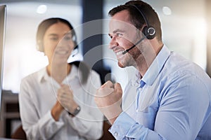 Celebration, man and woman with headset, yes and success of target, telemarketing and notification on computer. Agency