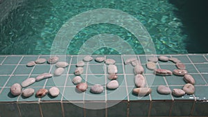 Celebration of new year,Date 2019 is laid out by pebble stones on the edge of the pool in the tropical resort