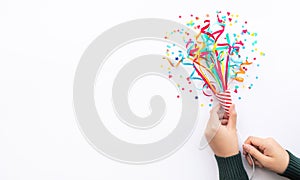 Celebration party and anniversary concepts ideas with woman hand holding colorful confetti,paper art on white color