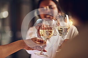 Celebration party, champagne and happy people toast for congratulations, New Year event or friendship reunion. Alcohol