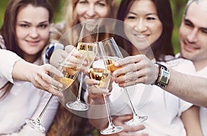 Celebration. People holding glasses of champagne making a toast