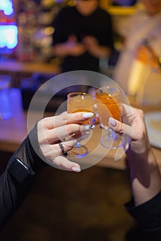 Celebration. People holding glasses of white wine making a toast.