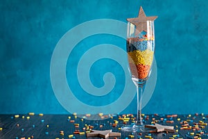 Celebration themed background with wooden stars colorful confetti in champaign class