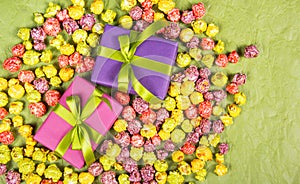 Gifts and sweets. Celebratory background. Multicolored popcorn and gift boxes