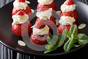 Celebratory dessert from a strawberry stuffed with whipped cream