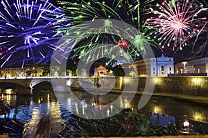 Celebratory fireworks over Sant ` Angelo Bridge. River Tiber. Rome. Italy