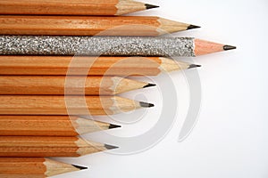 Celebratory pencil among usual pencils from left