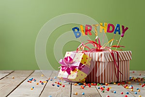 Celebratory scene with wrapped gift box signifies birthday occasion