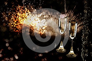 Celebratory toast with champagne glasses. New Year`s Eve background.