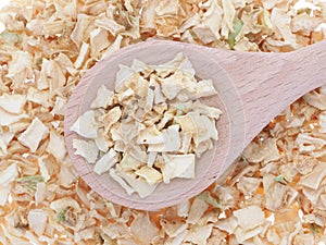 Celery Apium graveolens dried slices in wooden spoon