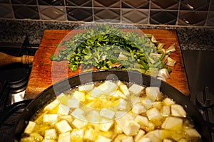 Celery meal cooked in a cast iron pan, slops