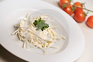 Celery Root Remoulade, classic bistro salad julienned celery root melds with a Dijon mustard dressing on a white plate