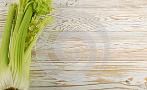 Celery stalks on wood background