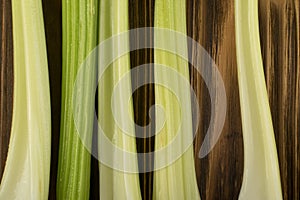 Celery stalks on wood background