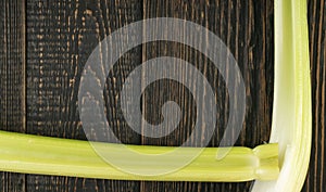 Celery stalks on wood background