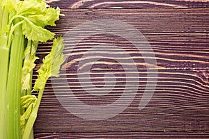 Celery stalks on wood background