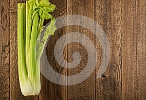 Celery stalks on wood background