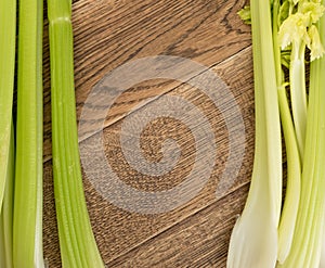 Celery stalks on wood background