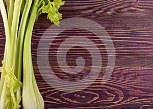 Celery stalks on wood background