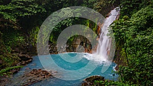 Celestial blue waterfall and pond in volcan tenorio national park