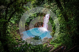 Celestial blue waterfall in volcan tenorio national park costa rica