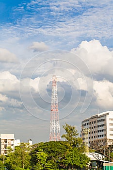 Cell antenas blue sky white clouds and sunlight