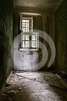 Cell from an old closed down mental institution photo