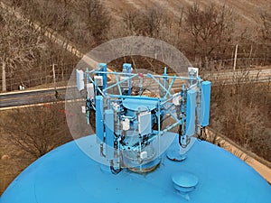 Cell phone antenna array mounted on top of a water tower