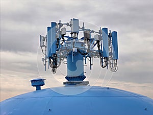 Cell phone antenna array mounted on top of a water tower