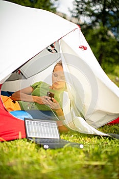 Cell phone charging with a solar charger in a tent