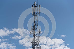 Cell phone data transmission tower on blue natural background