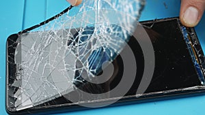 The cell phone repair.A broken screen smartphone.Urgent professional help.