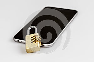 Cell phone security - lock and phone on white