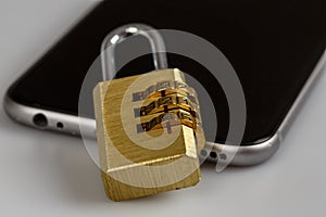 Cell phone security - lock and phone on white