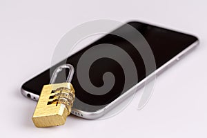 Cell phone security - lock and phone on white