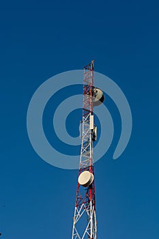 Cell phone tower with clear blue sky