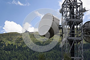 Cell phone transmitters on telecommunication tower in mountains