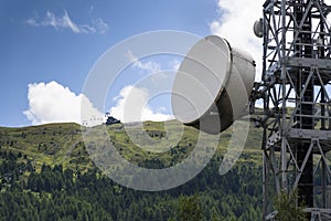 Cell phone transmitters on telecommunication tower in mountains