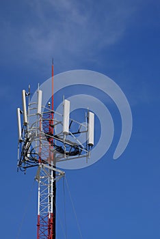 Cell site tower with blue sky.