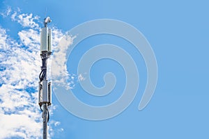 Cell tower against the blue sky.