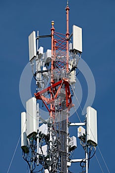 Cell tower antenna soars into blue sky