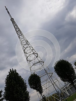 Cell tower on a background cloudy sky