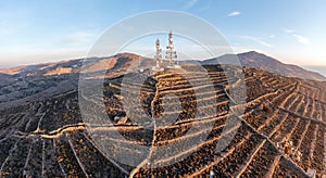 Cell tower. Cellular base station, mobile phone antenna aerial view. Rural background