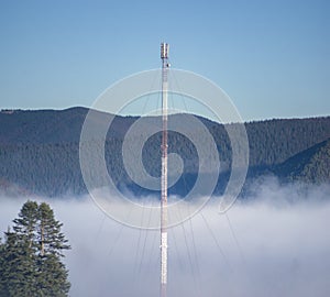Cell tower in the fog in the mountains