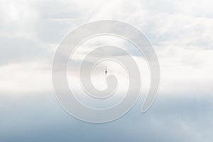 Cell tower in the mountains above the clouds lighthouse minimalist concept empty space text ad