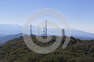 Cell towers and Ferris wheel on the mountain Big Ahun, Sochi