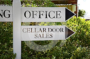 Cellar door sign at winery entrance, close up.